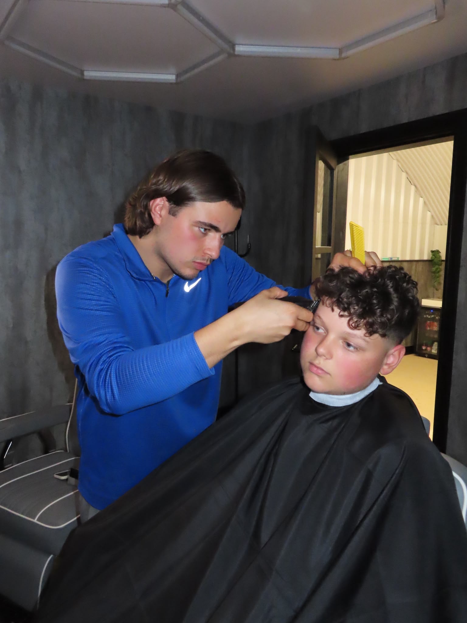 Jaden cutting hair at Reset MCR